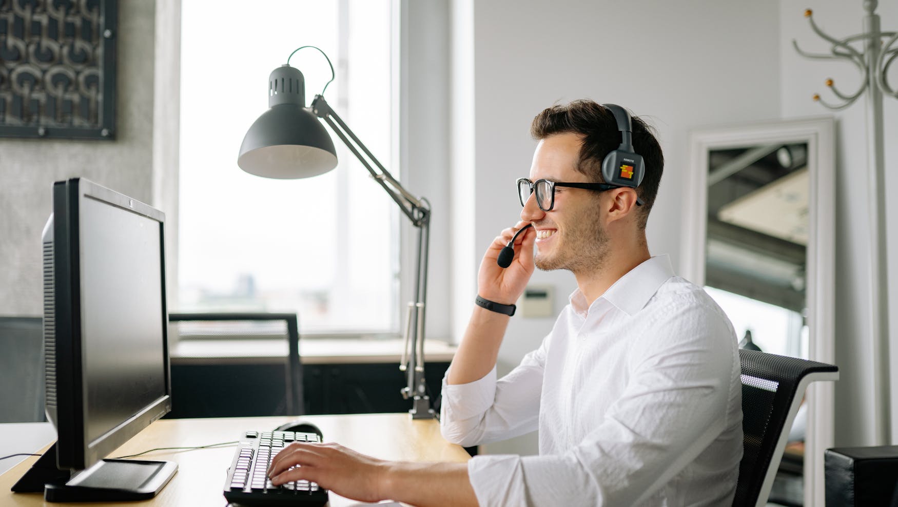 Man Using Headset To Take A Phonecall